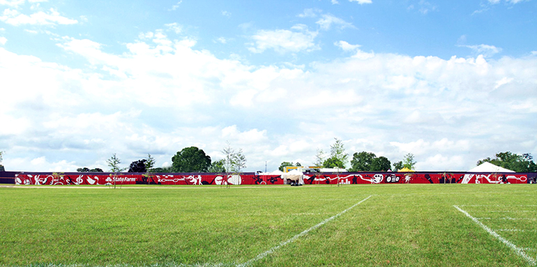 State Farm Bonnaroo Mural installed — 307-foot wall across the festival field
